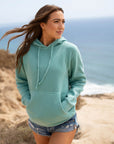 Eternal Fabric Hoodie in Pigment Mint, side view showing jersey-lined hood and sewn eyelets