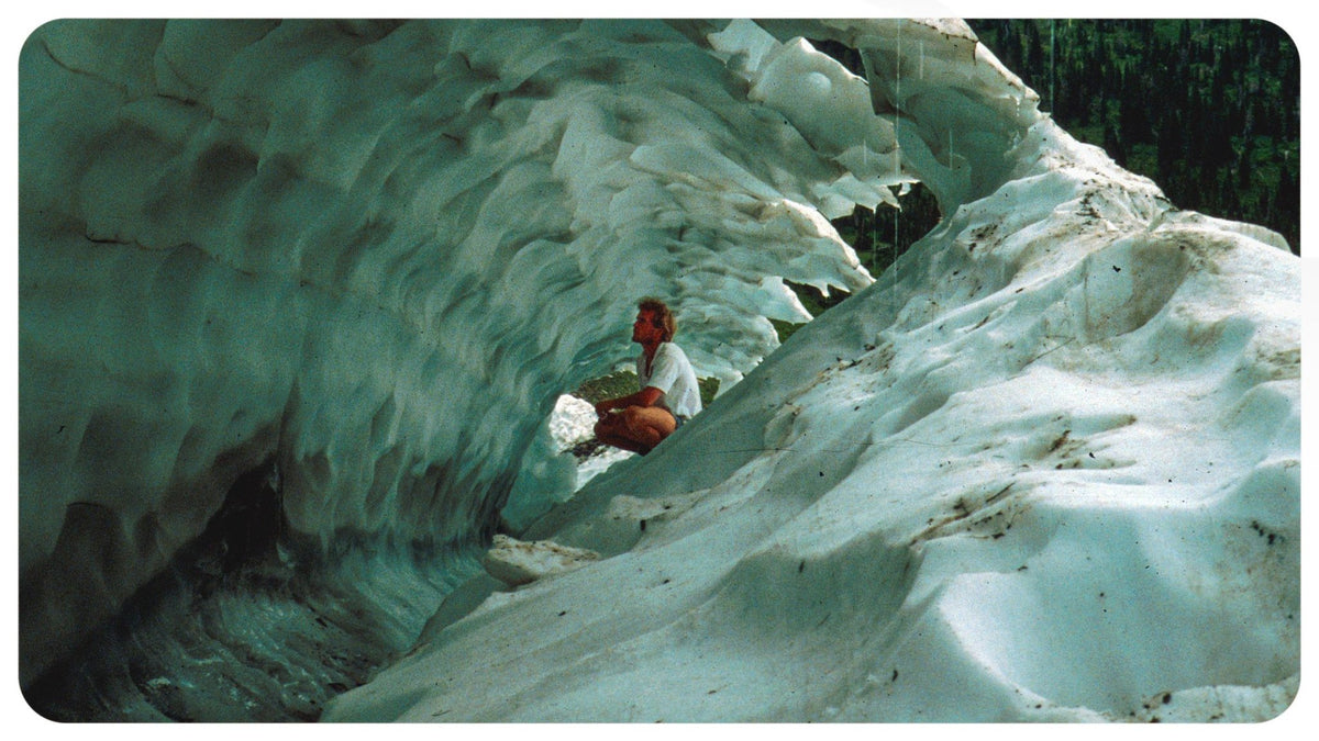 A person exploring an ice cave in Glacier National Park, Montana