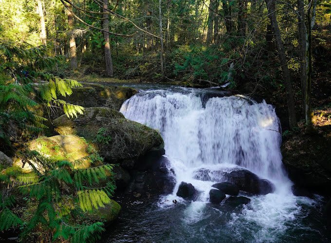 Whatcom Falls cascading under the 1939 stone bridge in Bellingham, Washington