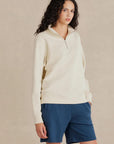 Form Organic Quarter Zip in Parchment, women's side view showing YKK nickel zipper and hem ribbing